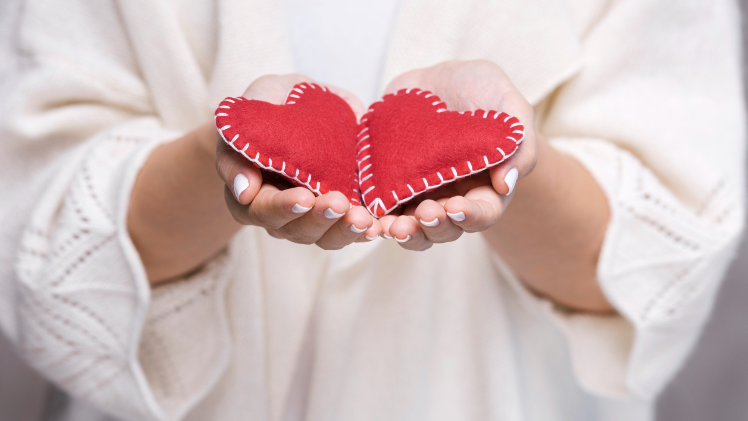 Hand holding hearts