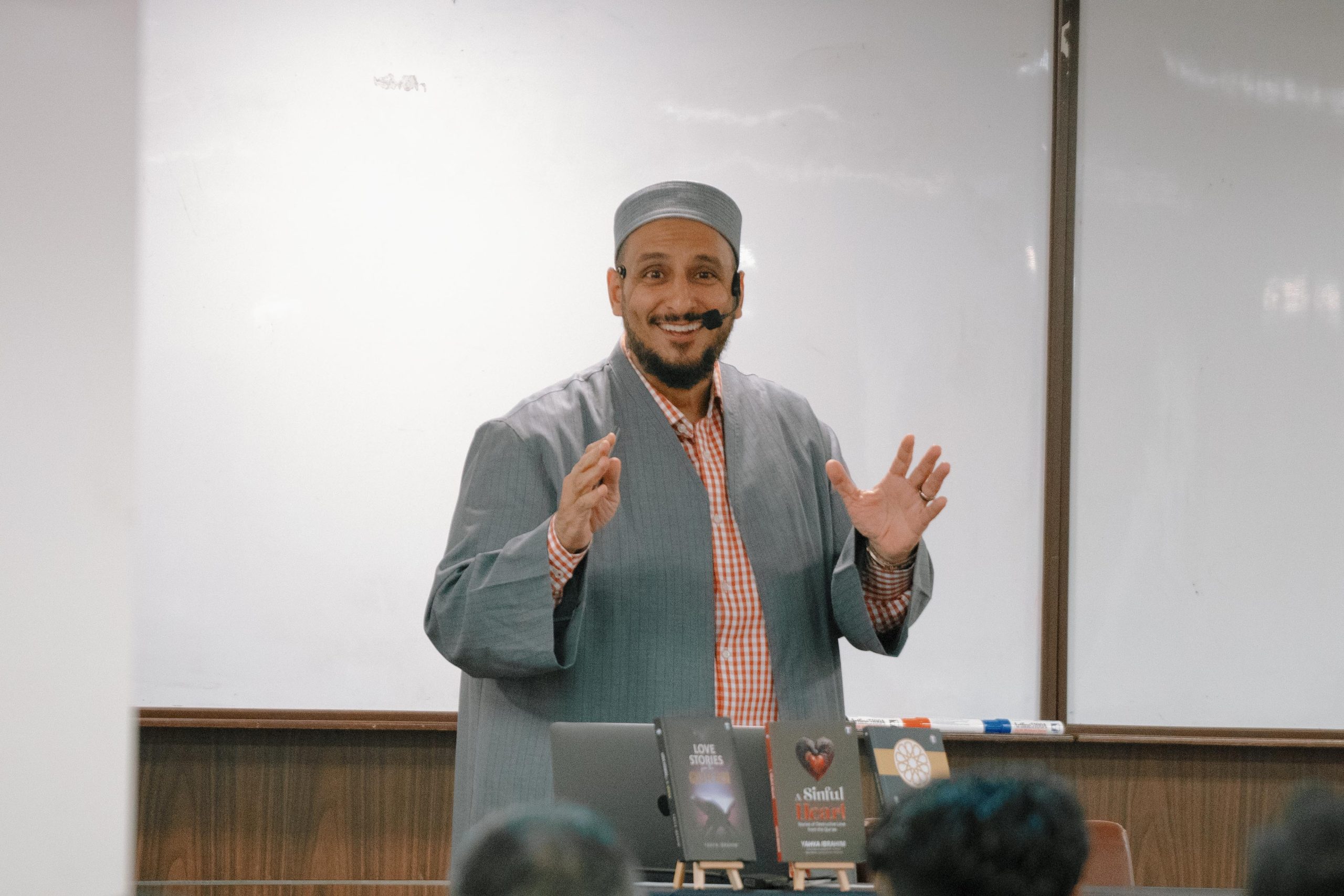 Yahya Ibrahim smiling while talking during his event